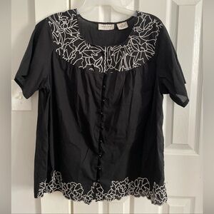 Chic Black Blouse with White Floral Design